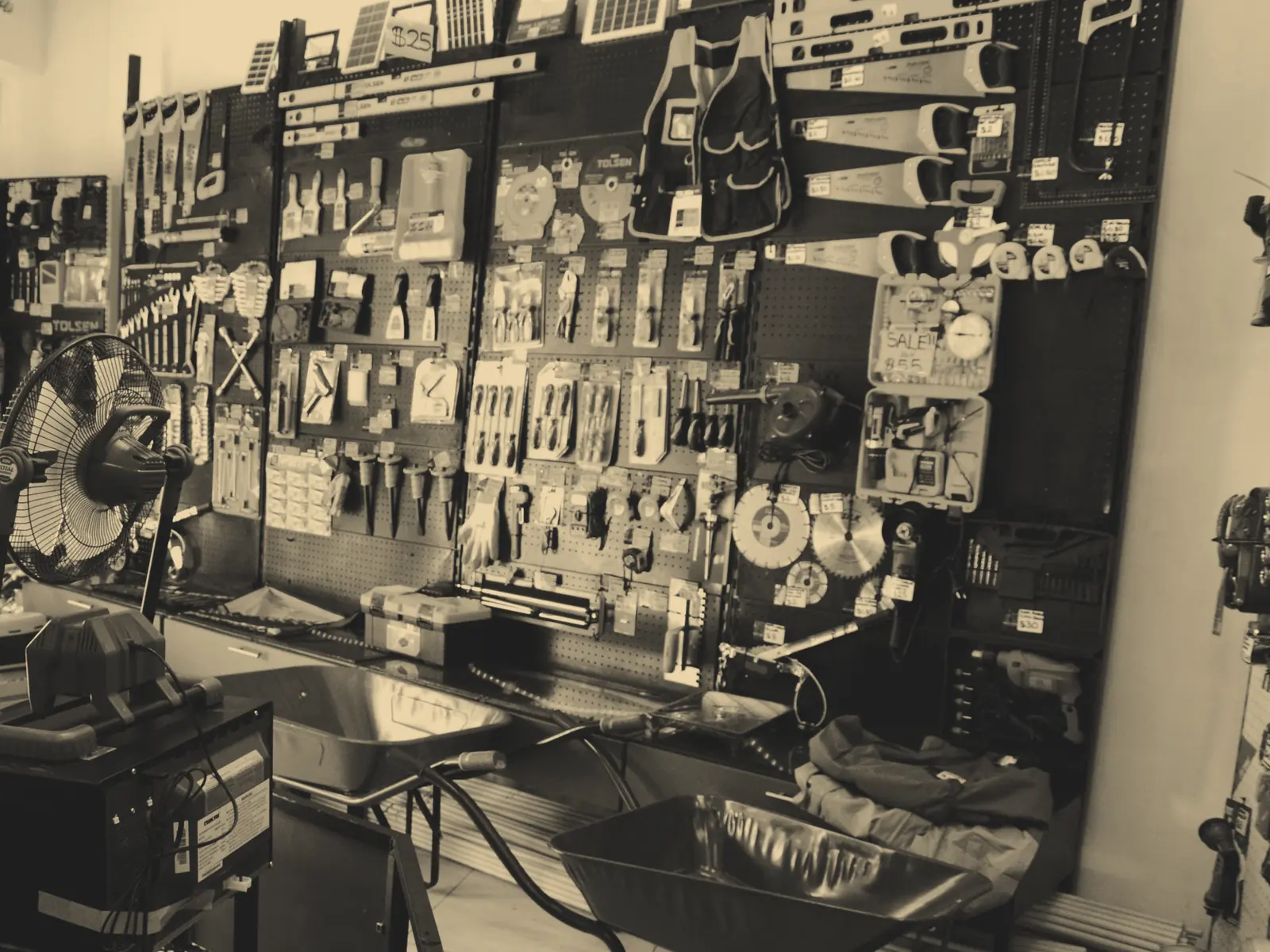 Tolsen tool wall and wheelbarrows inside one of our shops