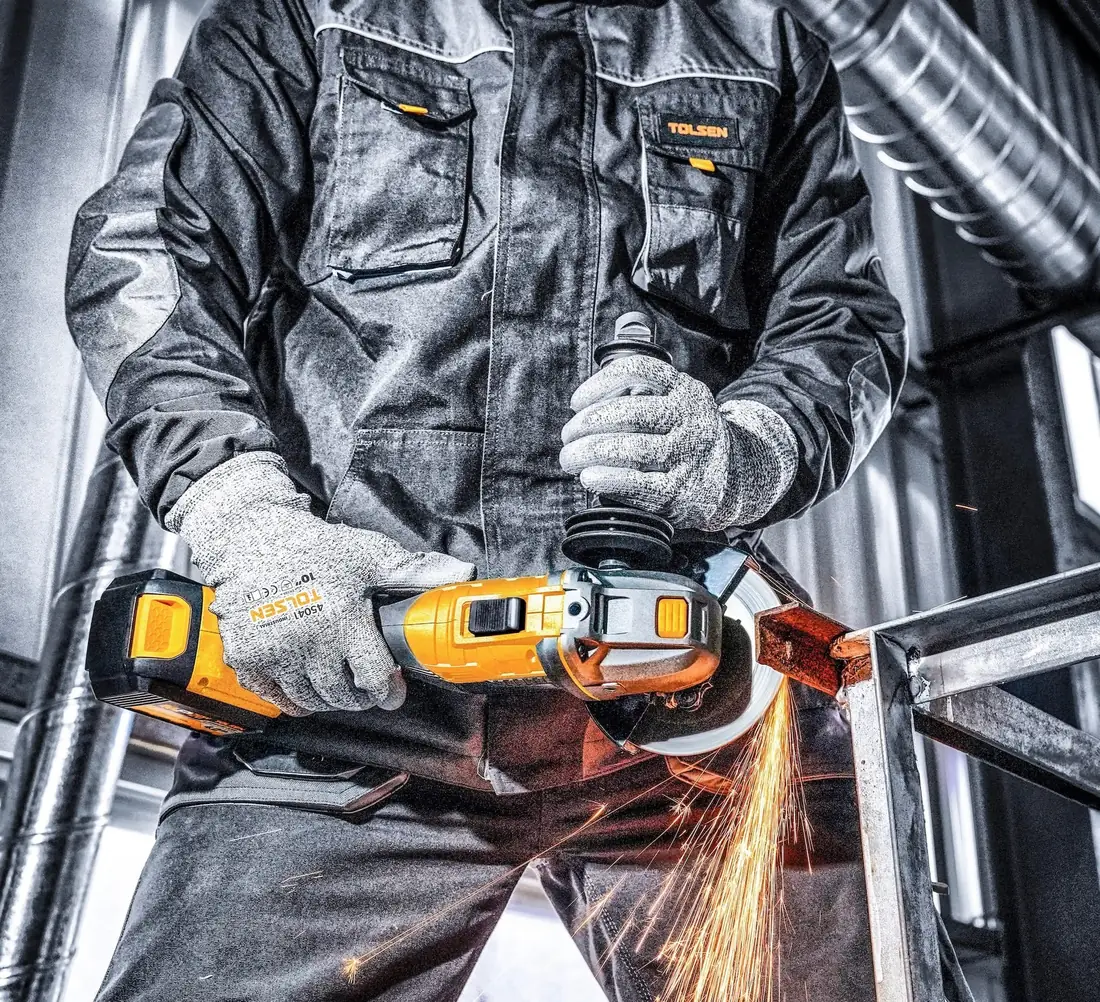A Tolsen angle grinder cutting steel